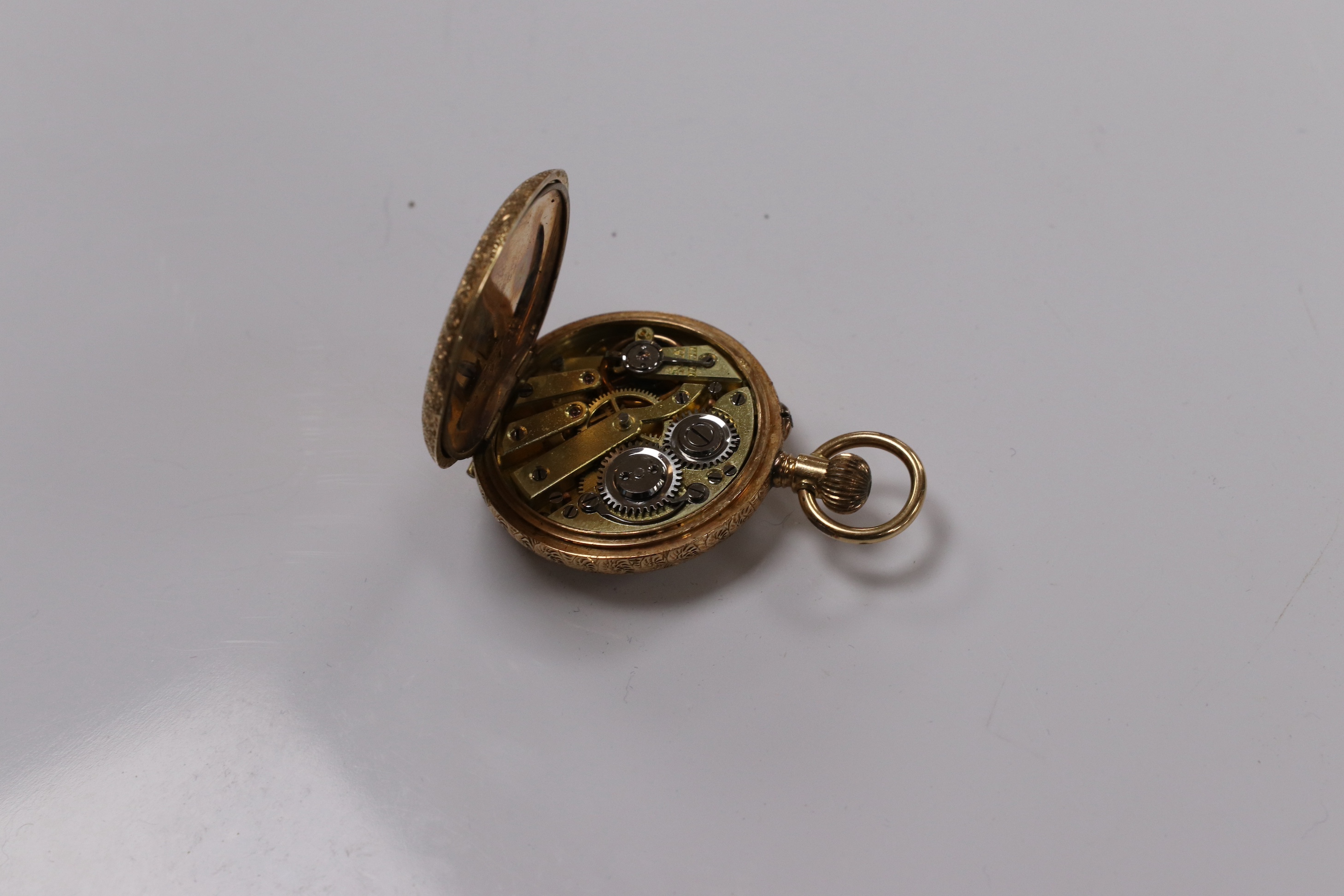 A lady's 14ct and enamel open face keyless fob watch, gross weight 16.6 grams. Condition - poor to fair